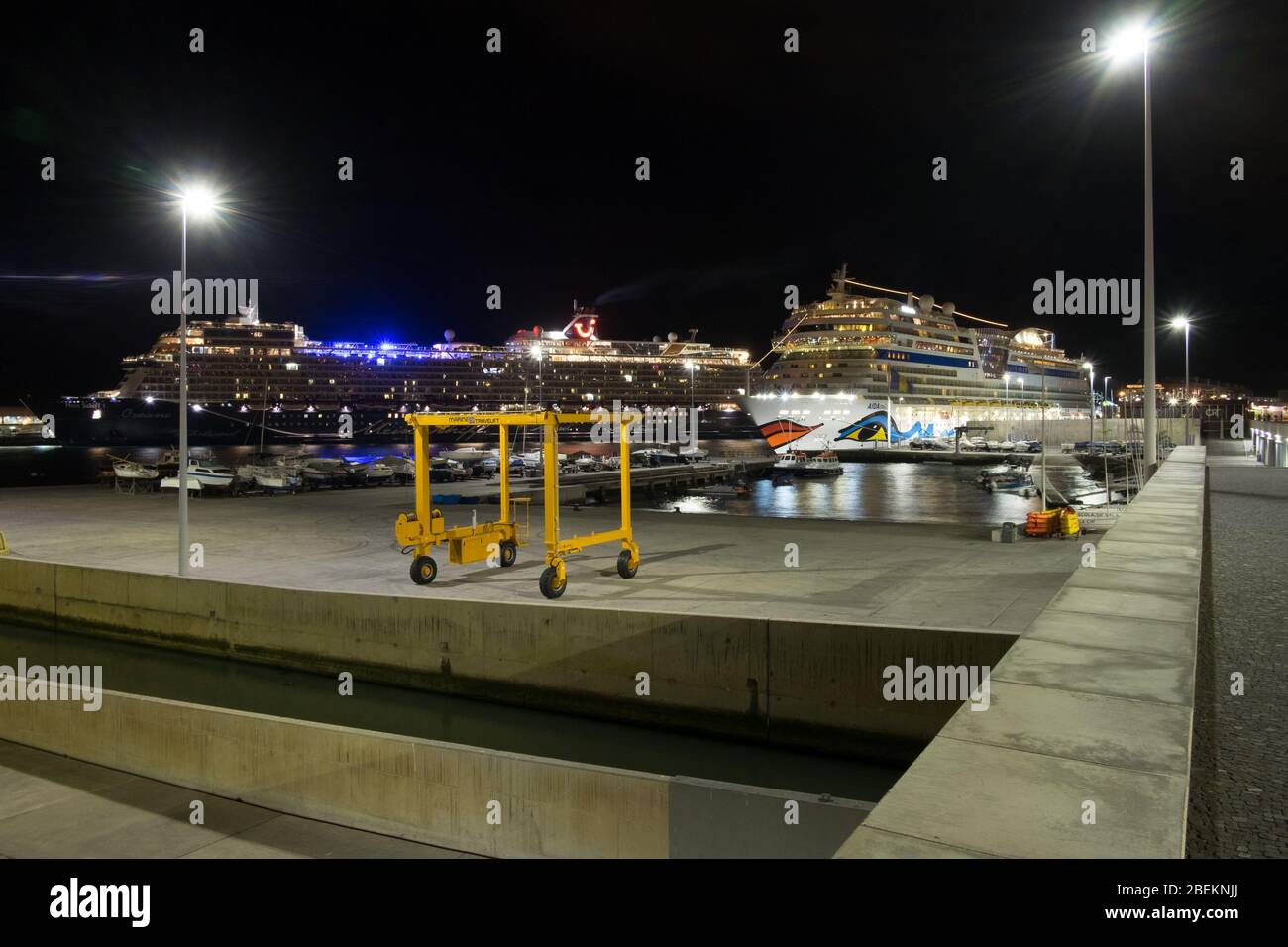 Two cruise ships docked at Funchal harbour Madeira at night time; Stock Photo