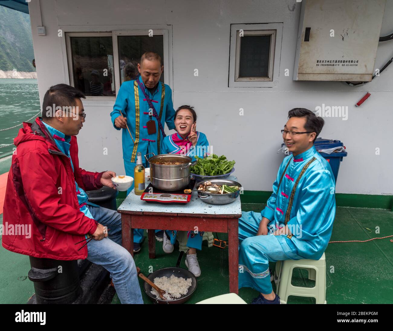 Sampan Tour Guides at lunch, Goddess Stream, Yangtze River Stock Photo