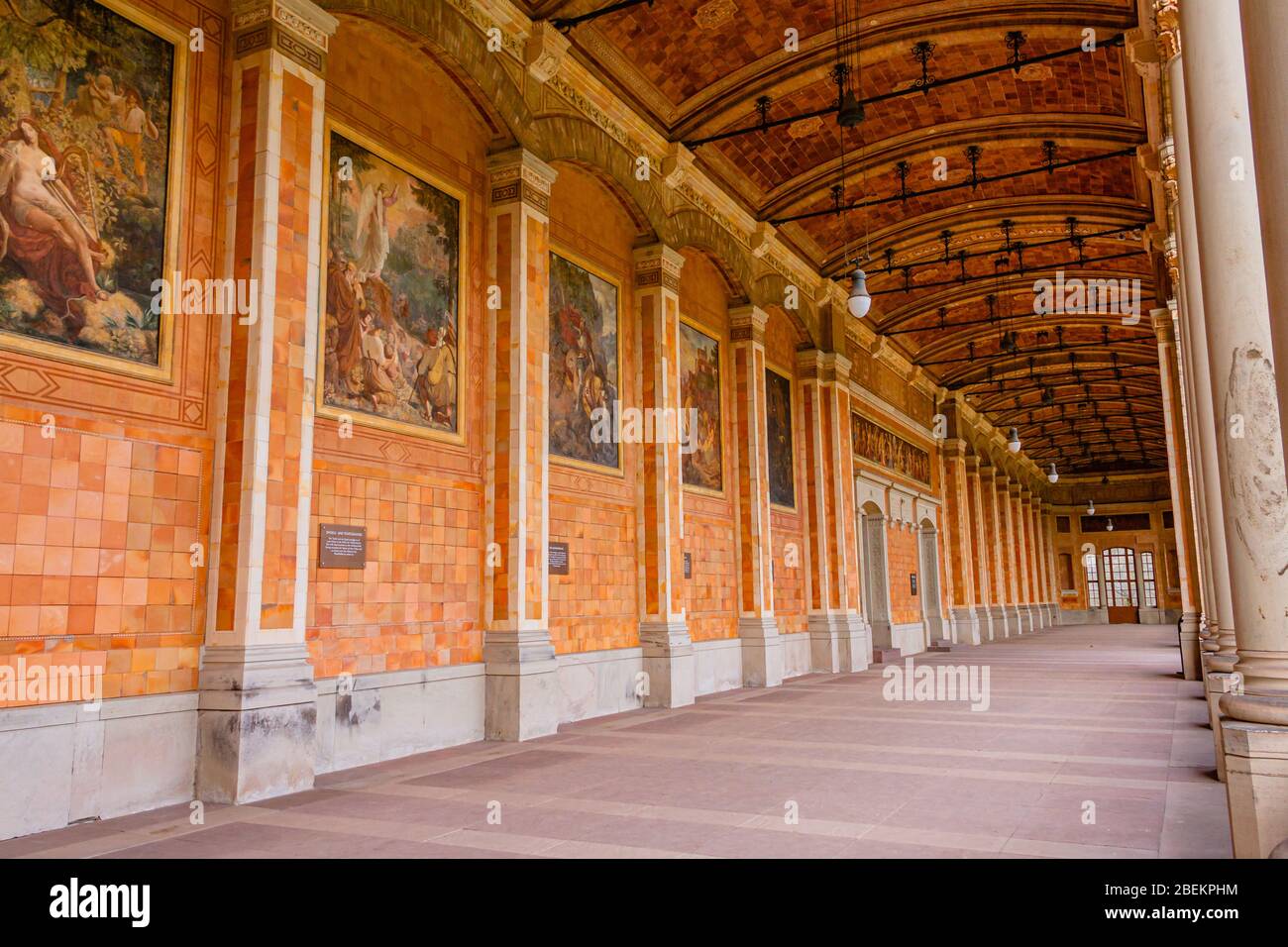 Inside the front arcade of the frescoed Trinkhalle, or pump house, part of the Kurhaus complex in the spa town of Baden-Baden, Germany. January 2020. Stock Photo