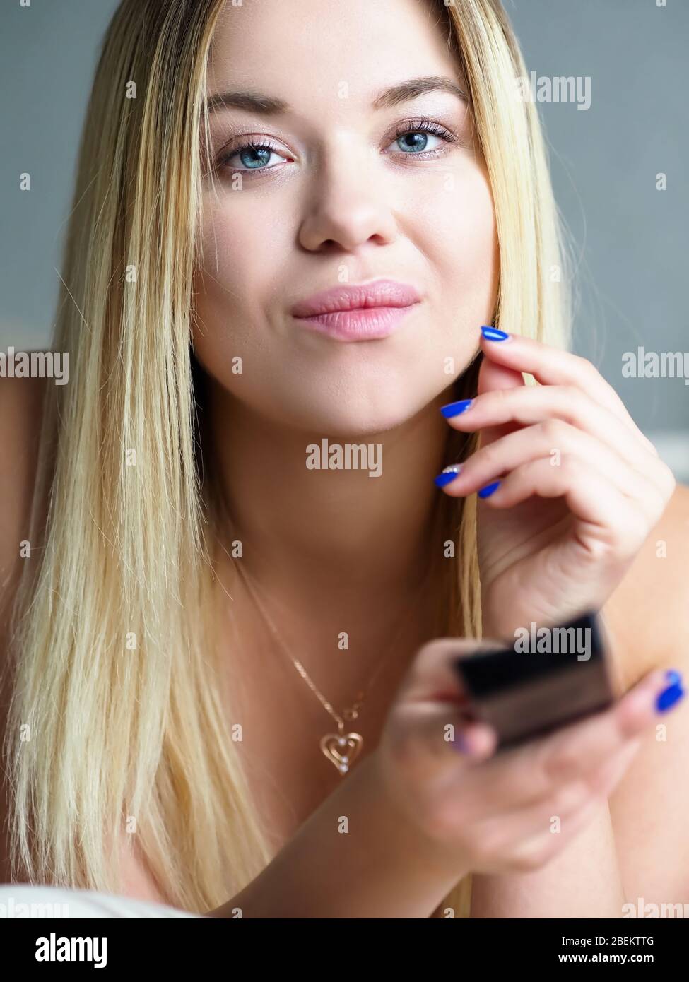 Attractive person watching television Stock Photo
