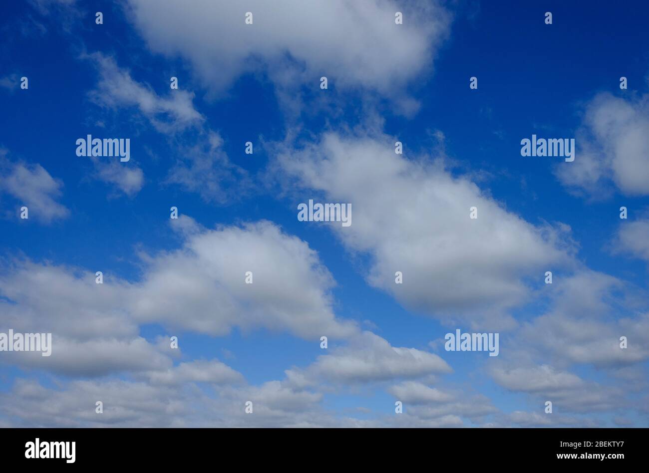 white clouds on bright blue sky Stock Photo