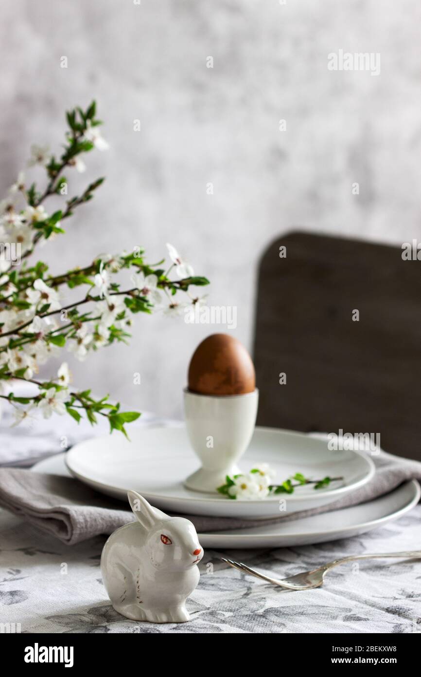 Decorated Easter table with blooming cherry plum. Stock Photo