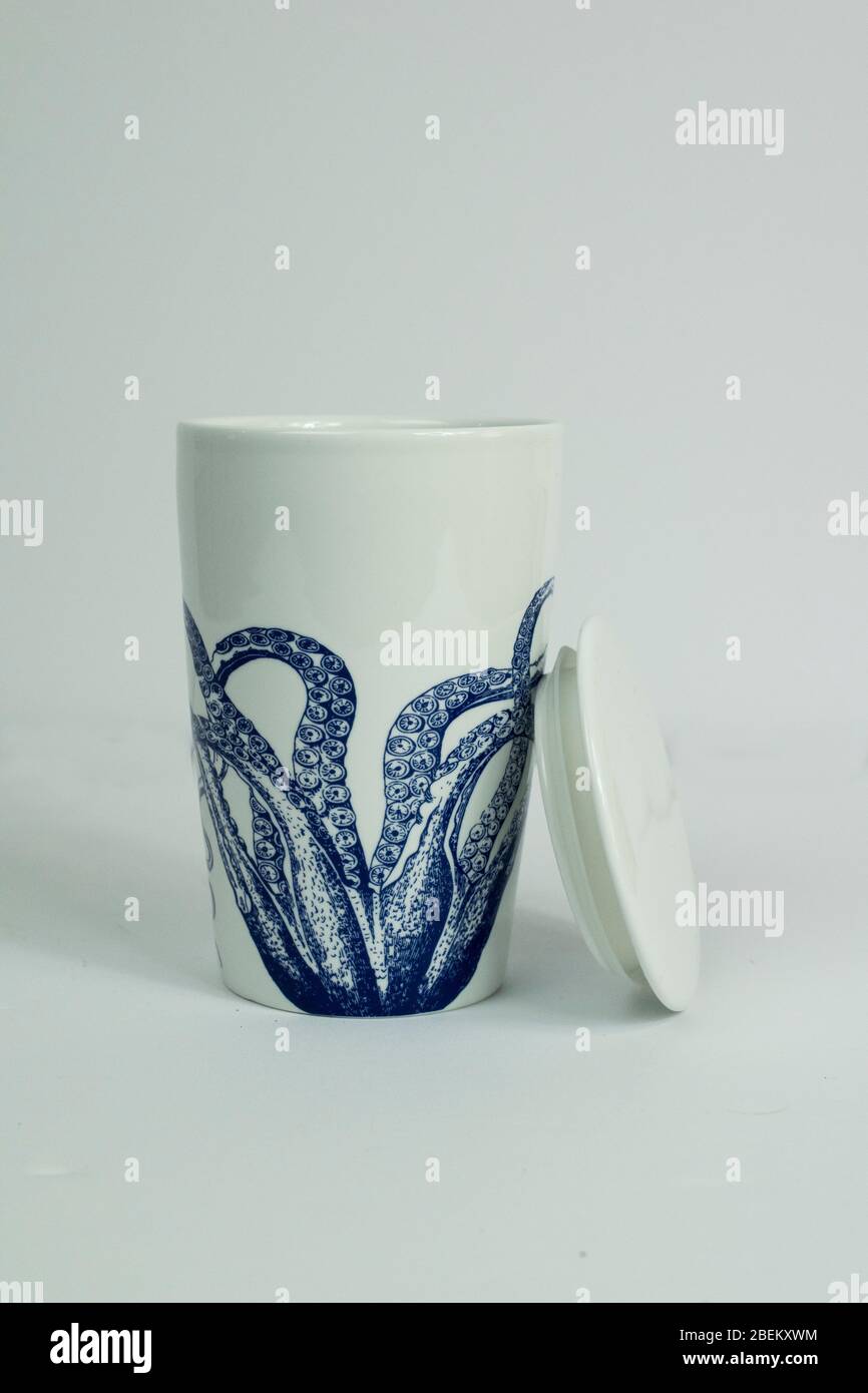 White and Blue Porcelain Octopus Tea Mug Stock Photo