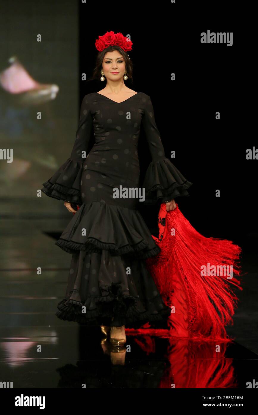 SEVILLA, SPAIN - JAN 30: Model wearing a dress from the Arpegio collection by designer Catarina Santos Rodrigues as part of the SIMOF 2020 (Photo credit: Mickael Chavet) Stock Photo