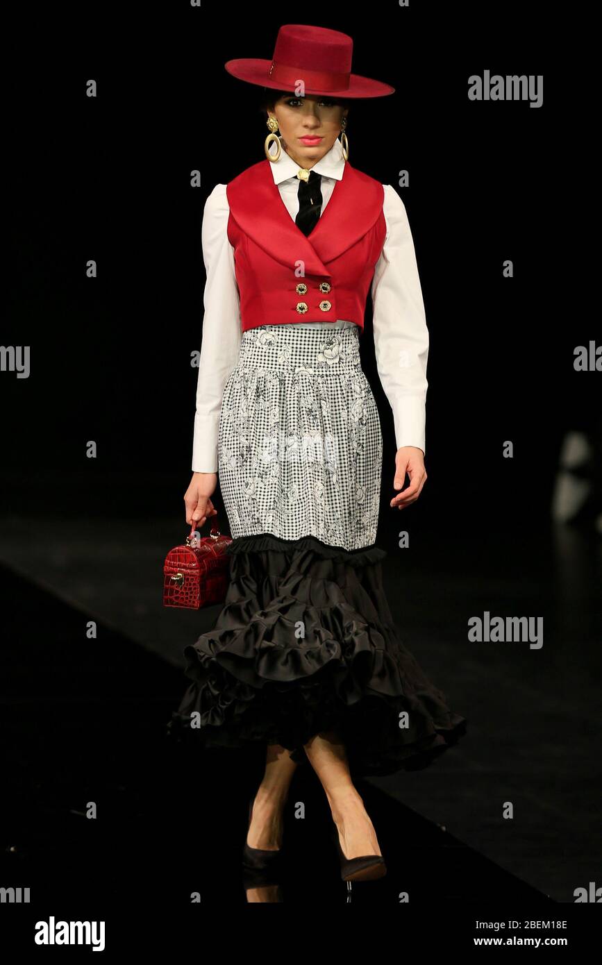 SEVILLA, SPAIN - JAN 30: Model wearing a dress from the Arpegio collection by designer Catarina Santos Rodrigues as part of the SIMOF 2020 (Photo credit: Mickael Chavet) Stock Photo