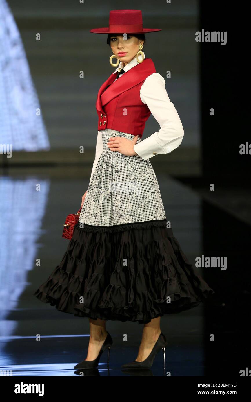 SEVILLA, SPAIN - JAN 30: Model wearing a dress from the Arpegio collection by designer Catarina Santos Rodrigues as part of the SIMOF 2020 (Photo credit: Mickael Chavet) Stock Photo