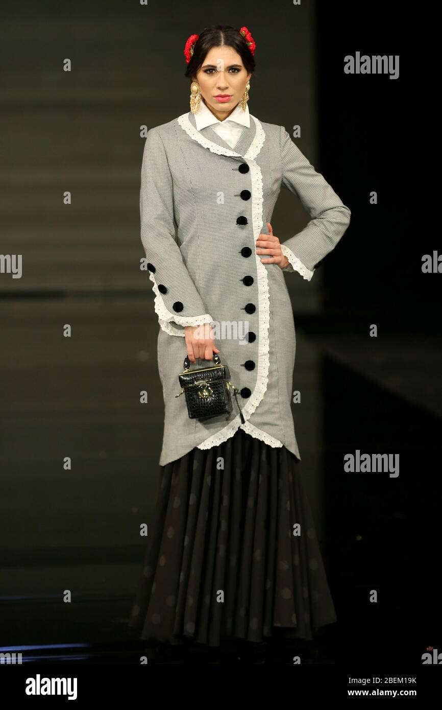 SEVILLA, SPAIN - JAN 30: Model wearing a dress from the Arpegio collection by designer Catarina Santos Rodrigues as part of the SIMOF 2020 (Photo credit: Mickael Chavet) Stock Photo