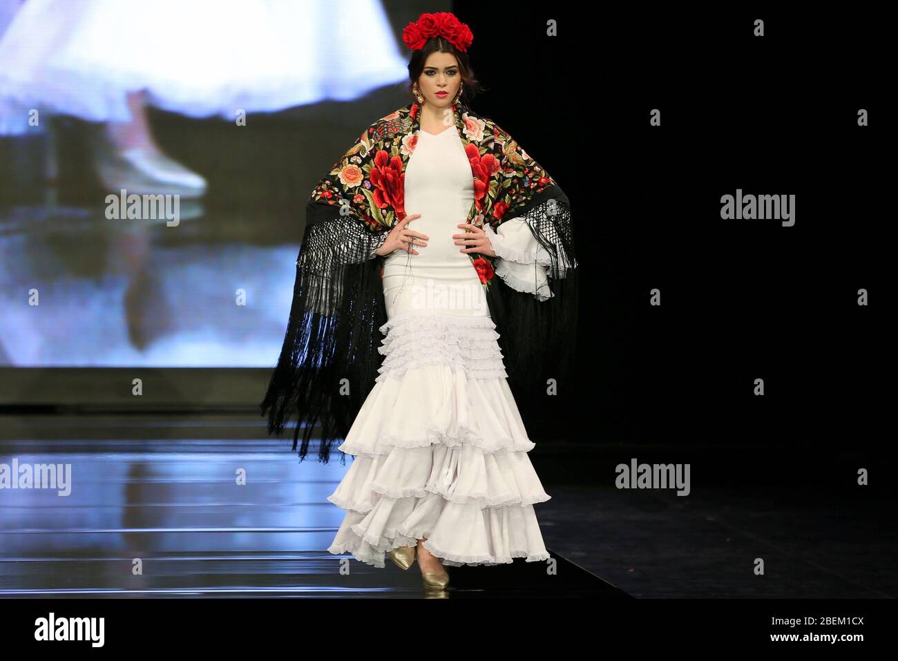 SEVILLA, SPAIN - JAN 30: Model wearing a dress from the Arpegio collection by designer Catarina Santos Rodrigues as part of the SIMOF 2020 (Photo credit: Mickael Chavet) Stock Photo