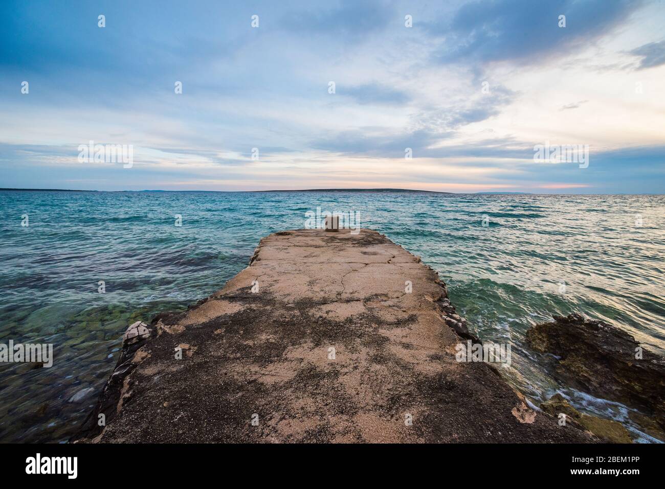 sunset on croatian stony beach Stock Photo