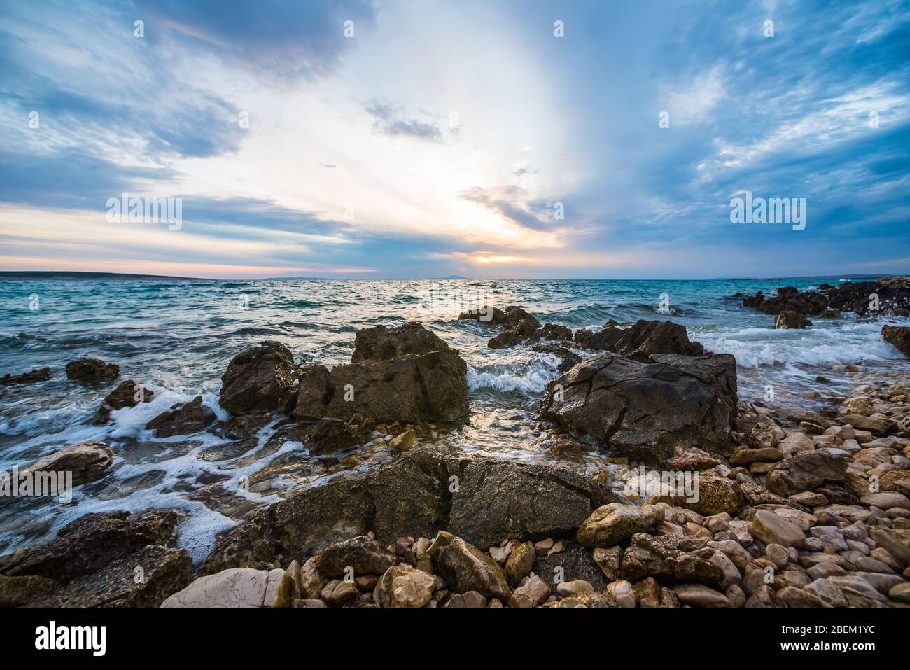 sunset on croatian stony beach Stock Photo