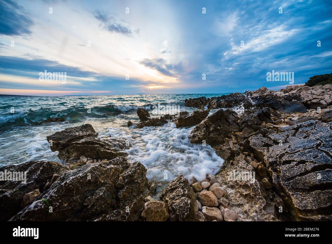 sunset on croatian stony beach Stock Photo