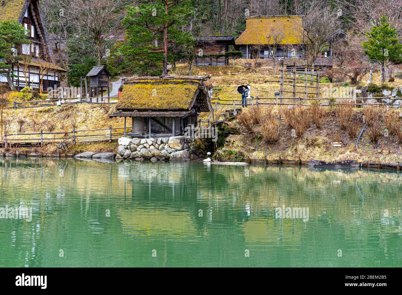 Pond and Hida Folk Village (Hida no Sato) with traditional HIda region ...