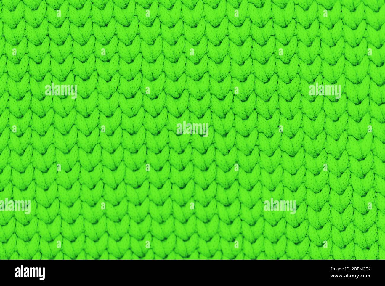 Bright green knitted fabric texture background Stock Photo - Alamy