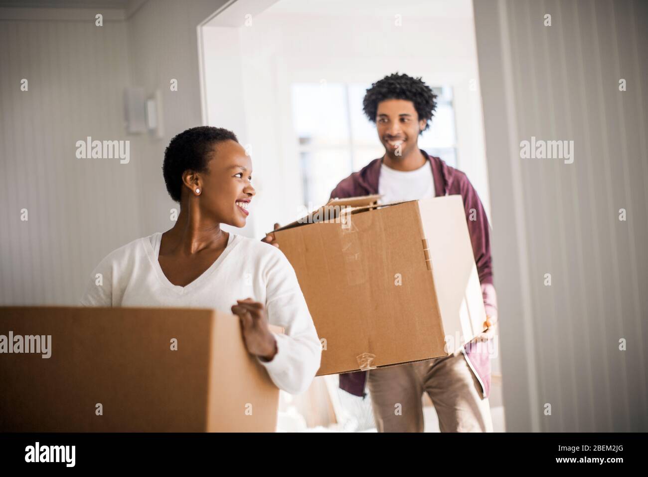 Happy couple moving into their new home Stock Photo