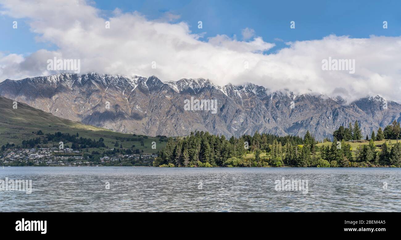 landscape with rocky Remarkables range loomig out of green Kelvin