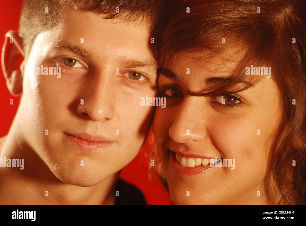 Young couple smiling and looking at the camera. Close view. Stock Photo