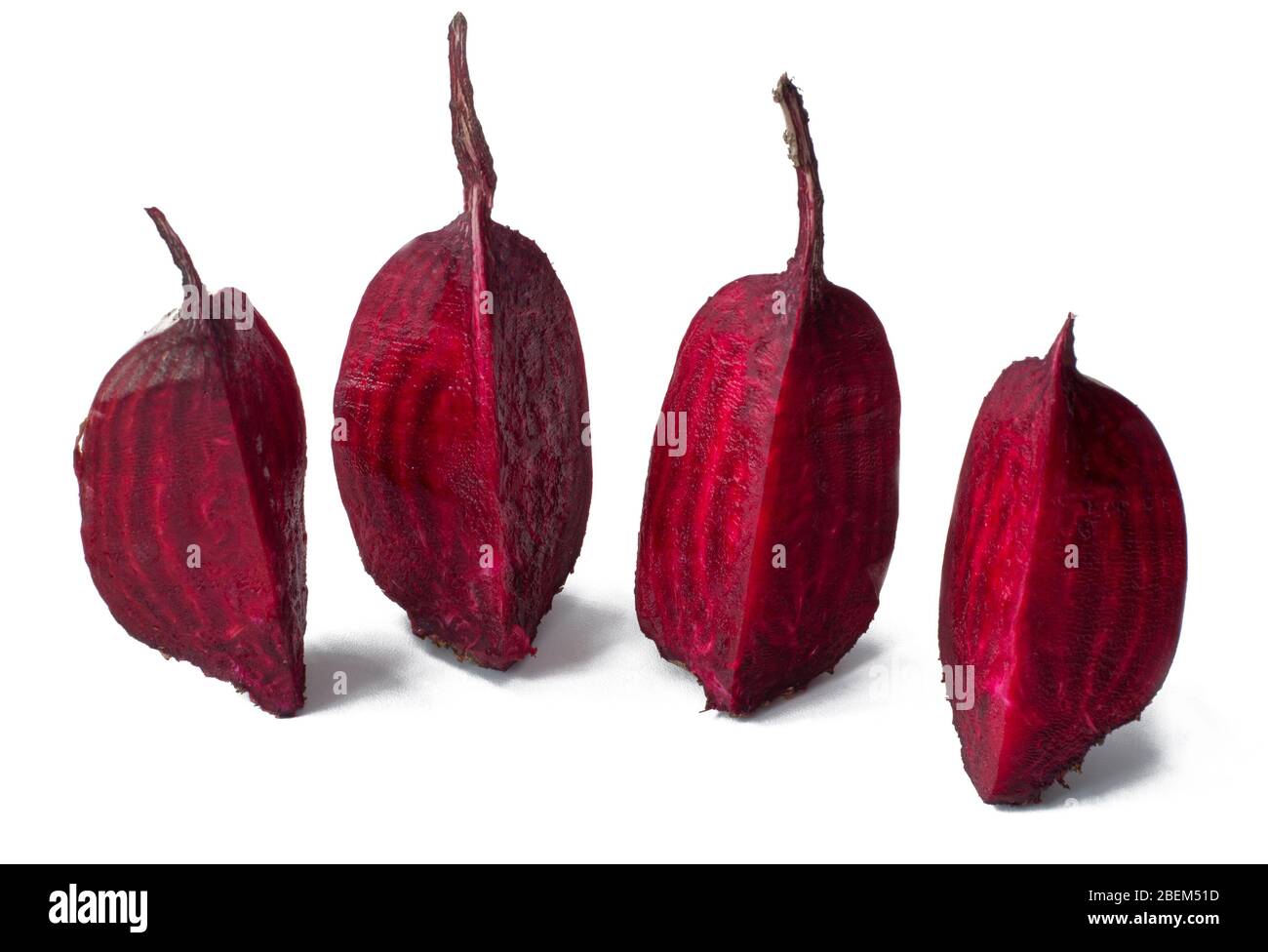 Cut into four pieces red beet isolated on white background Stock Photo