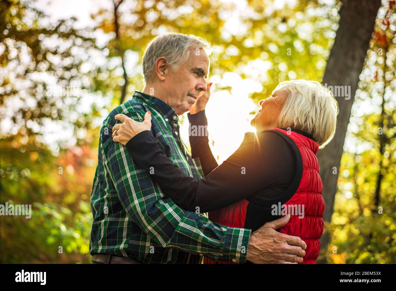 Senior couple dancing in the woods Stock Photo