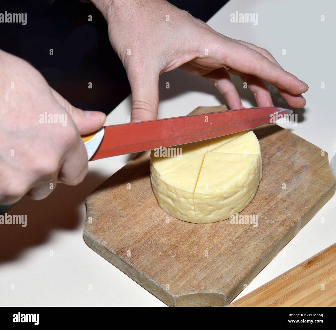 Man slice fresh milk product cheese hires stock photography and images