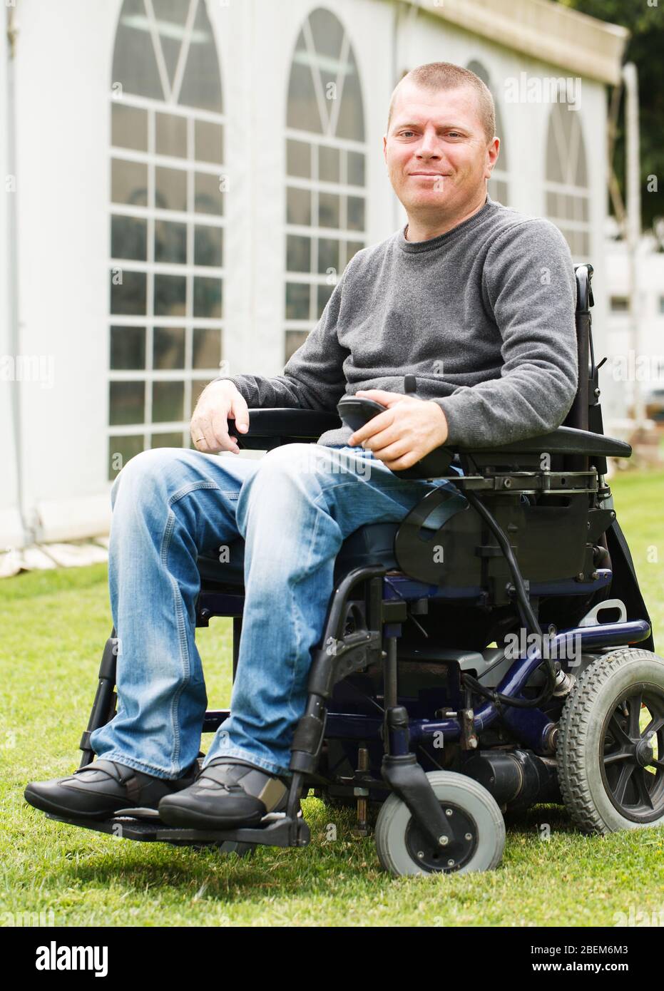 Disabled men smiling in a wheelchair Stock Photo