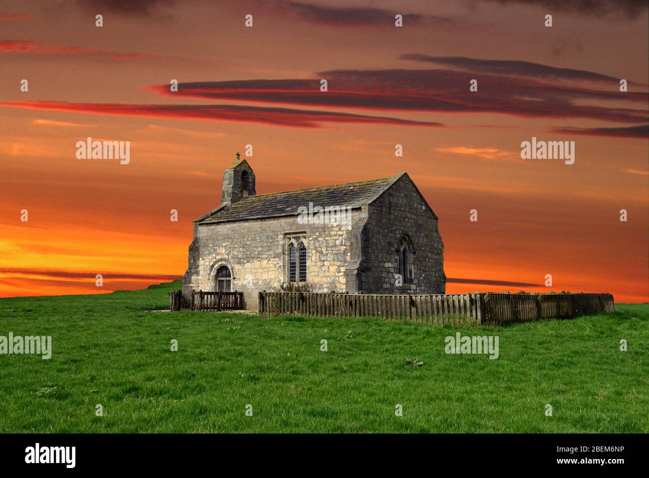 St Mary's Church, Lead, is an isolated, Yorkshire, chapel near the Battle of Towton (1461). In this fantasy image the sky and landscape is altered. Stock Photo