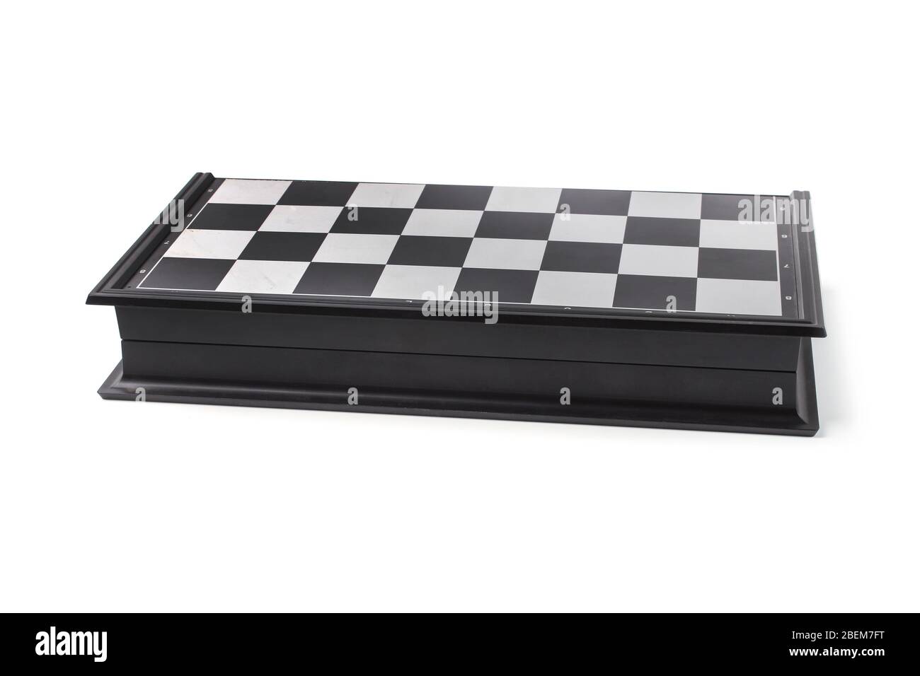 Folded plastic chessboard isolated on white background Stock Photo