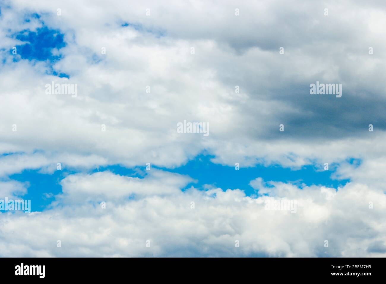 Clouds covering the blue sky, closeup as background Stock Photo