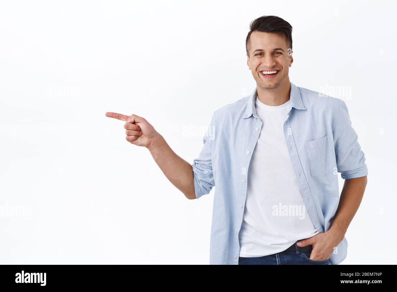 Portrait of happy, handsome masculine adult man pointing finger left and  smiling camera, recommend service or product, best quality item, showing way  Stock Photo - Alamy