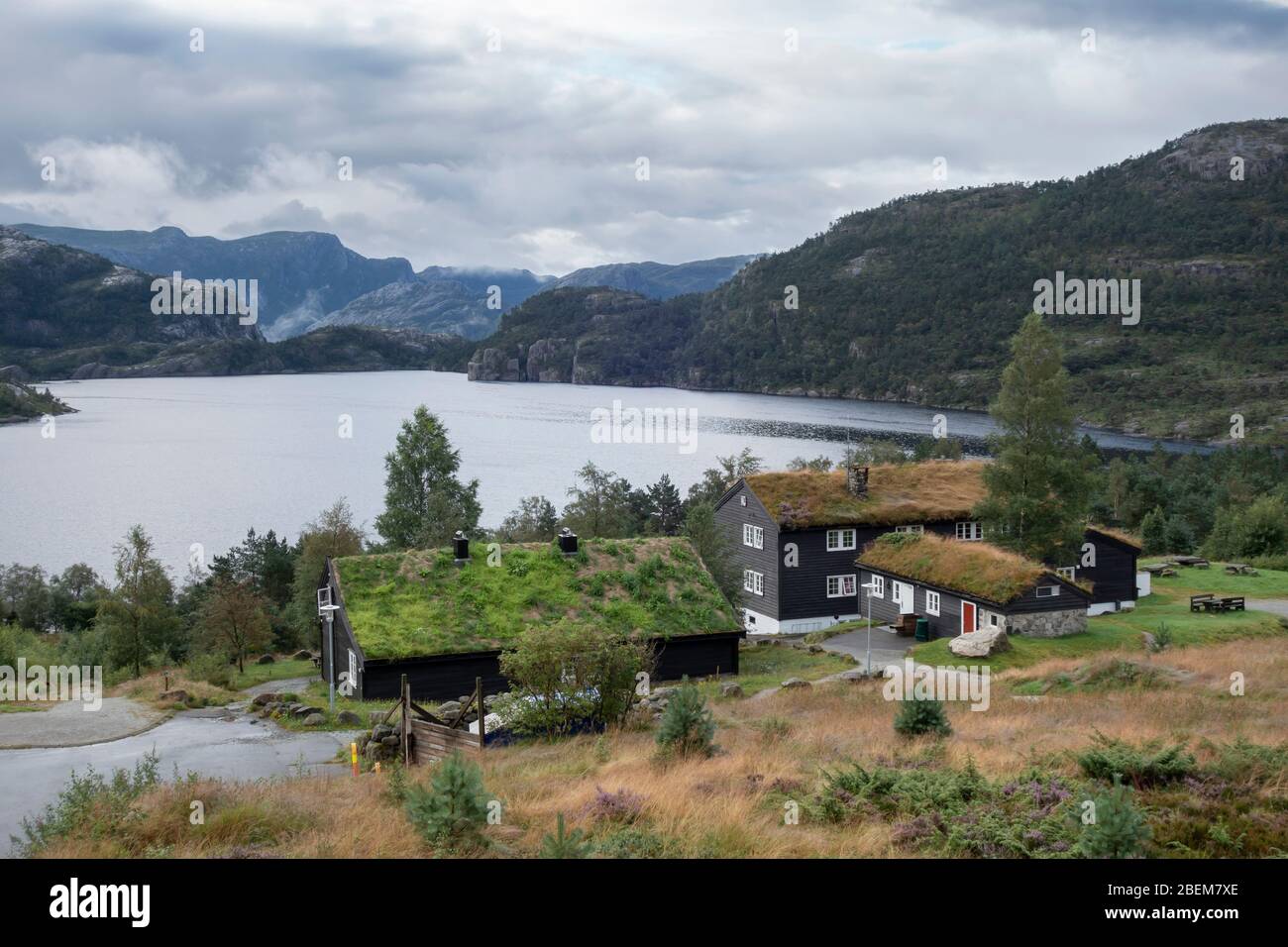 Traditional norwegian wooden houses with grass on the roof. Typical Norway architecture Stock Photo