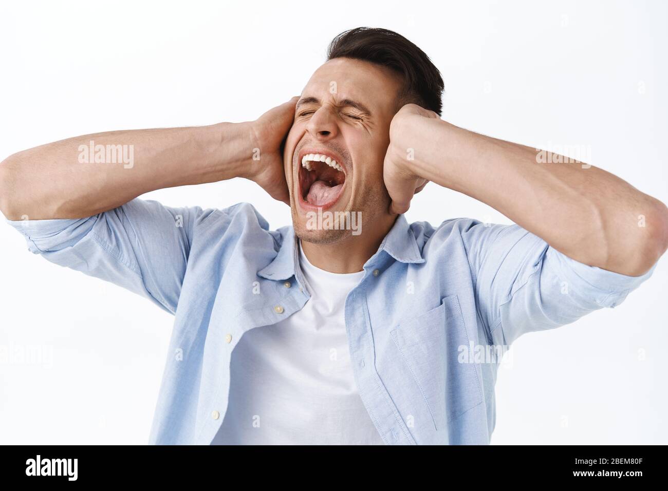Closeup portrait of man screaming and shaking head in denial, close
