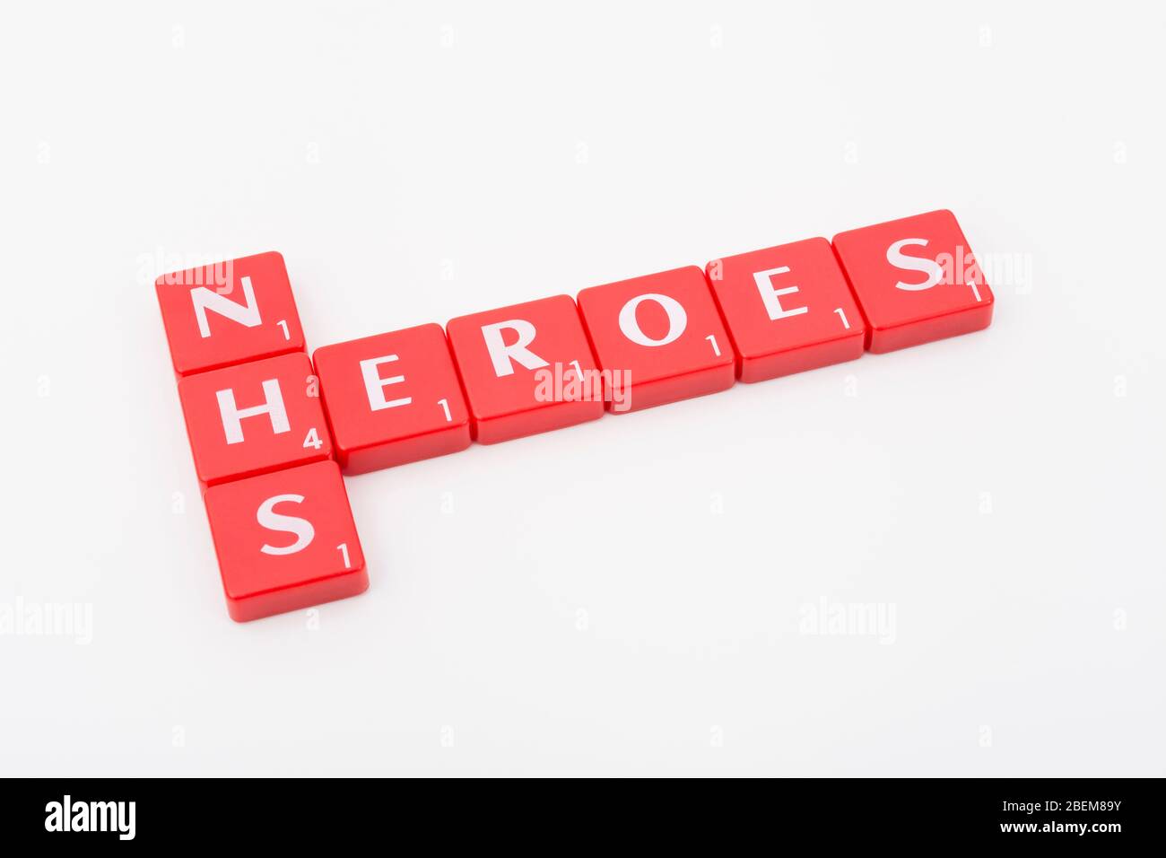 NHS Heroes letters tiles on off-white b/g. For NHS in CV19 Covid 19 pandemic, NHS staff, NHS prescriptions, UK National Health Service, medicine in UK Stock Photo