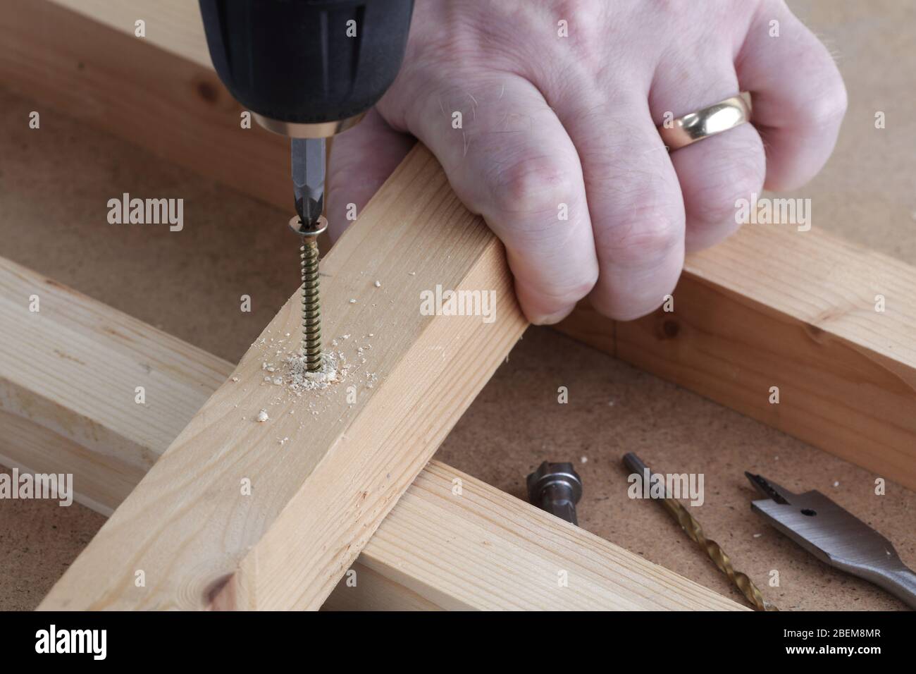 Drill screw and countersink wood on work bench Stock Photo Alamy