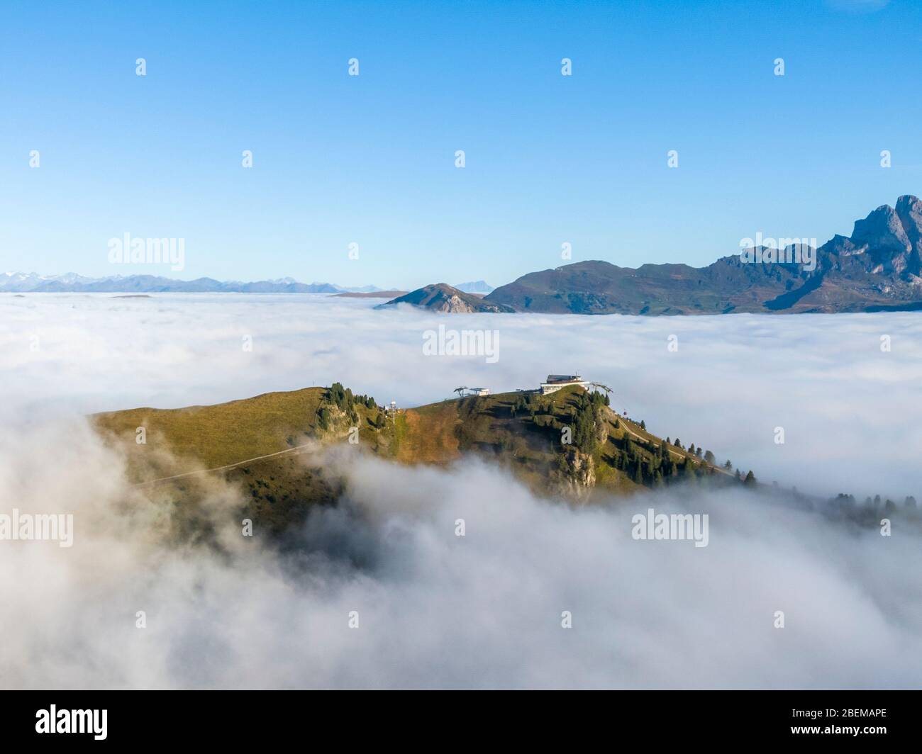 Cloud see around upper station of the Ciampinoi cable car in Italian Dolomites Stock Photo