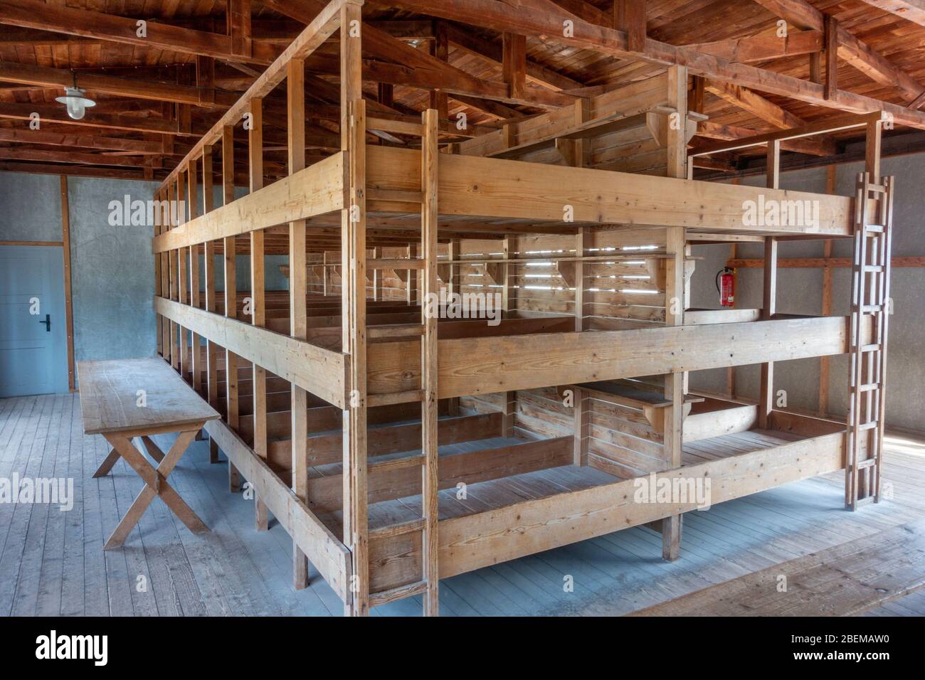 Bed bunks inside the barrack building (both building and beds