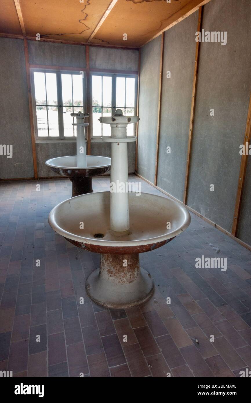 Washroom inside the prisoner barracks (reconstruction) inside the former Nazi German Dachau concentration camp, Munich, Germany. Stock Photo