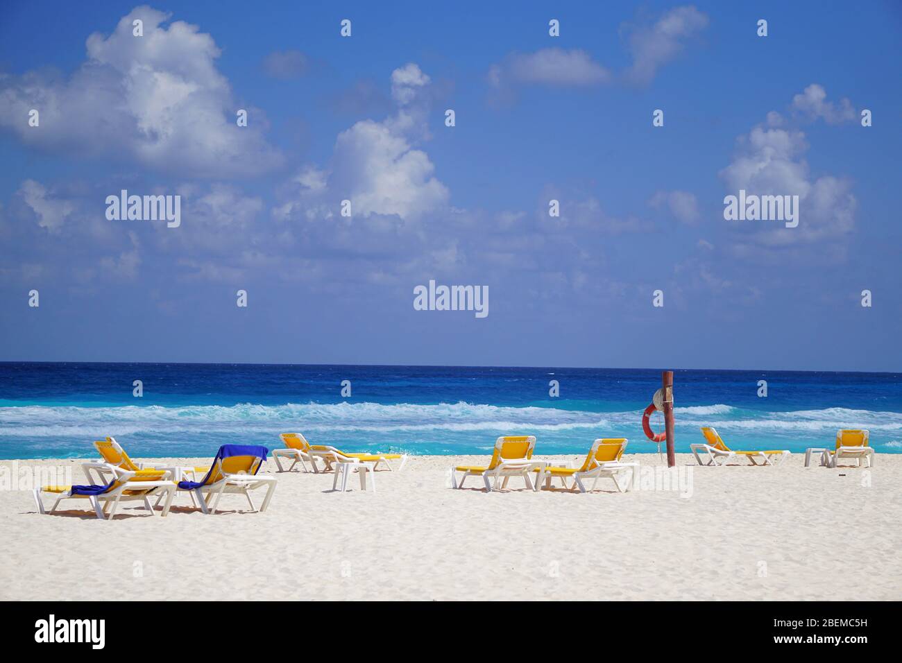 Quiet beach, blue sky, turquoise water, Cancun Mexico Stock Photo