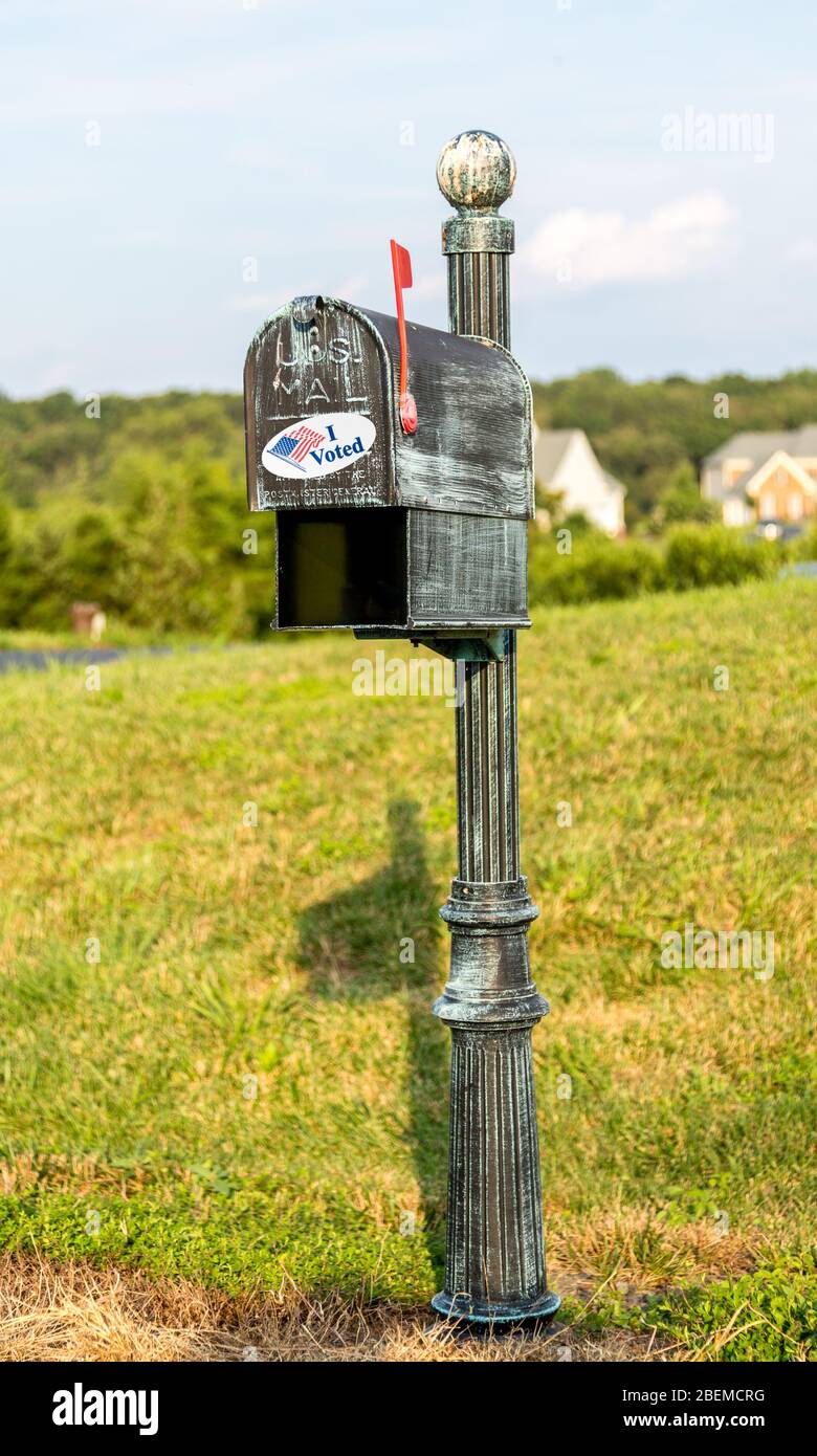 Metal mailbox for rural homes with I Voted sticker as concept for voting by mail or absentee ballot paper Stock Photo