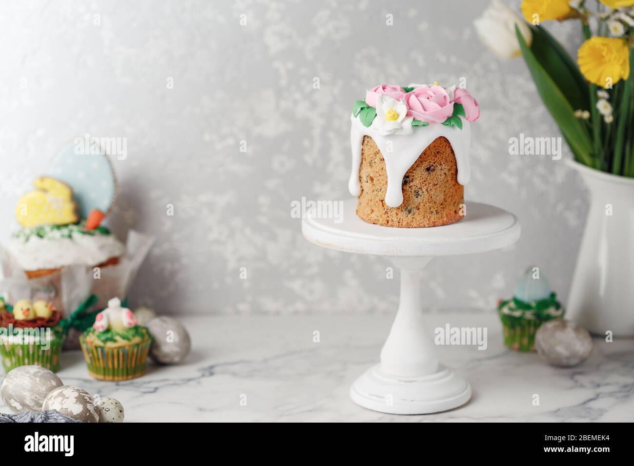 Easter cake on the stand on grey table. Holiday background, copy space Stock Photo
