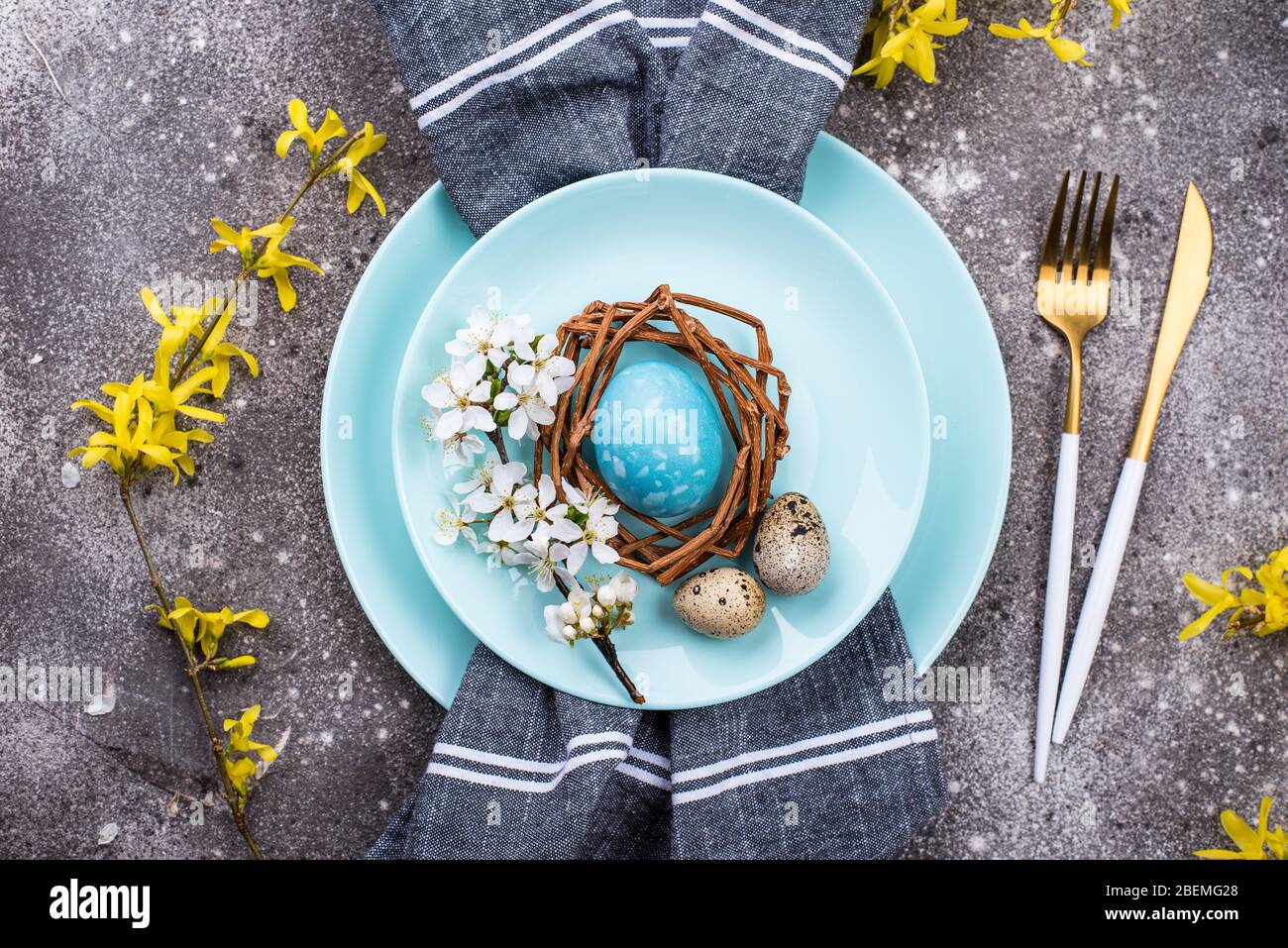 Easter table setting with blue egg Stock Photo