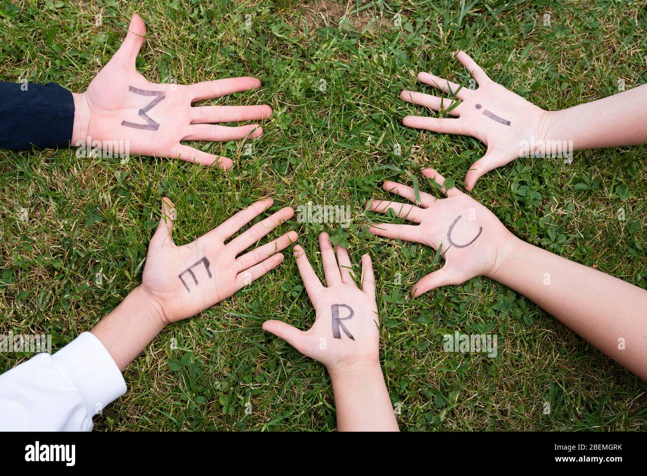 Word merci  on child hands Stock Photo