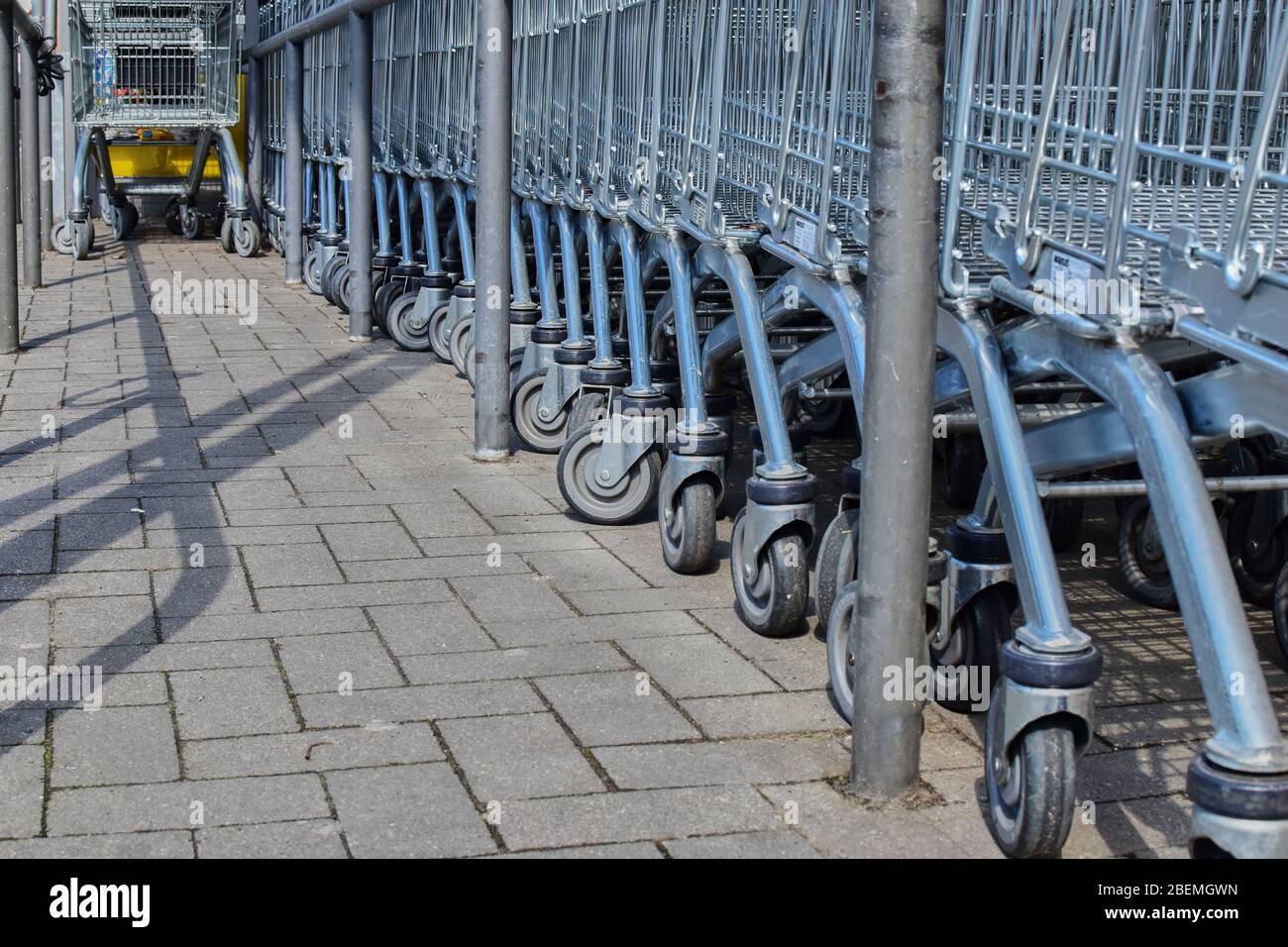 Berlin, Germany - April 2, 2018: View along a row of shopping carts at the height of the shopping carts. Stock Photo