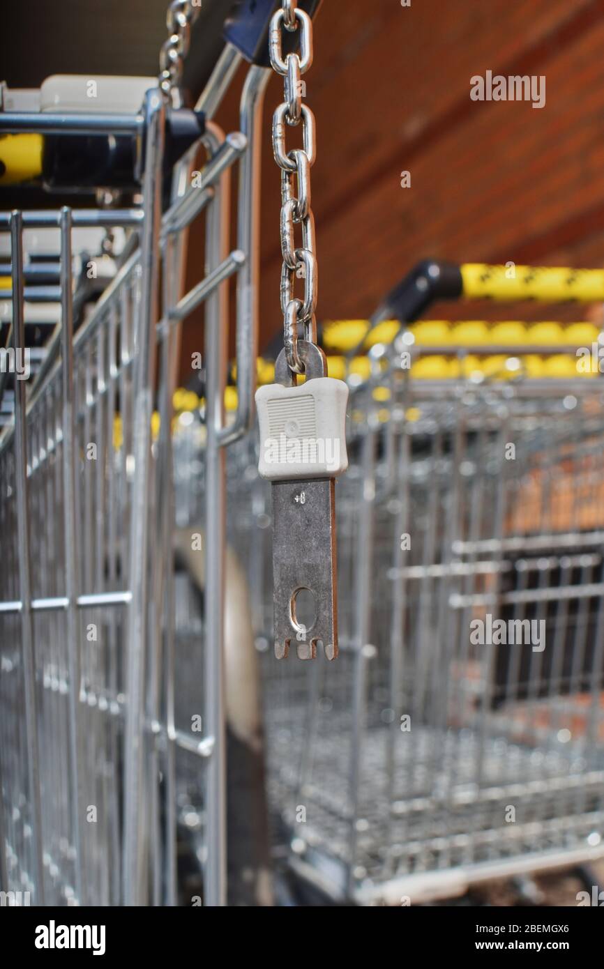 Berlin, Germany - April 2, 2018: View to the deposit lock at a shopping cart that can be solved with a coin. Stock Photo