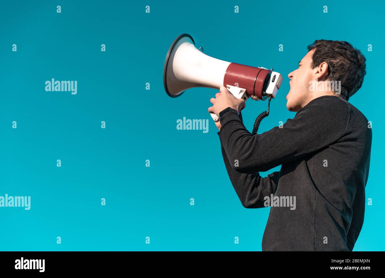 megaphone as a tool for loud communication of important news and information. Copy space. Isolated Stock Photo