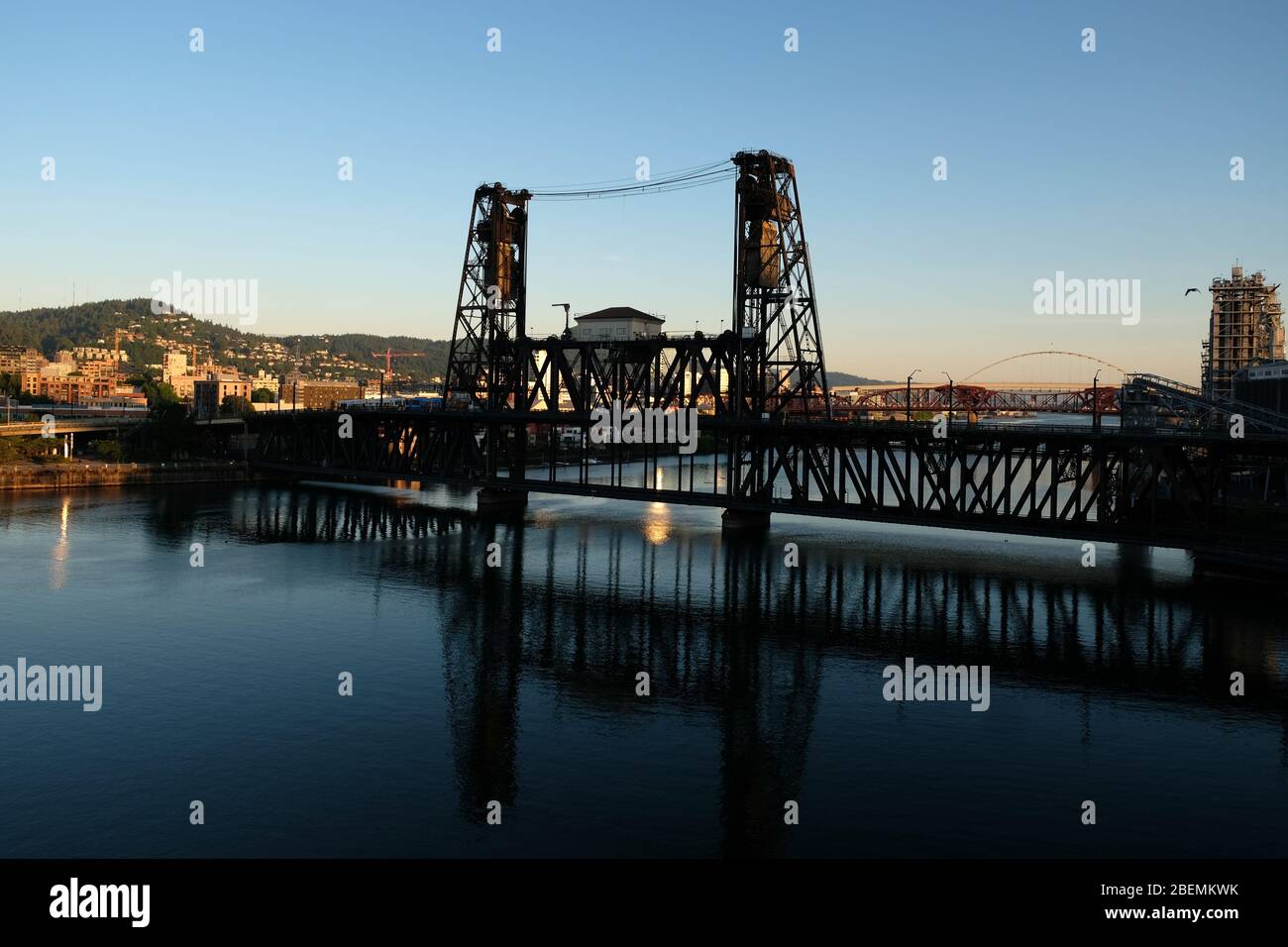 View of the unique historic telescoping rail and road lift steel bridge over the Willamette River in downtown Portland, Oregon Stock Photo