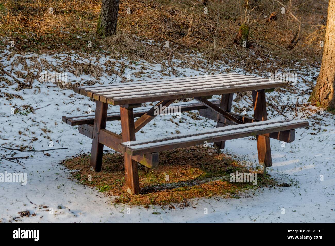 table with bench in the snowy park Stock Photo