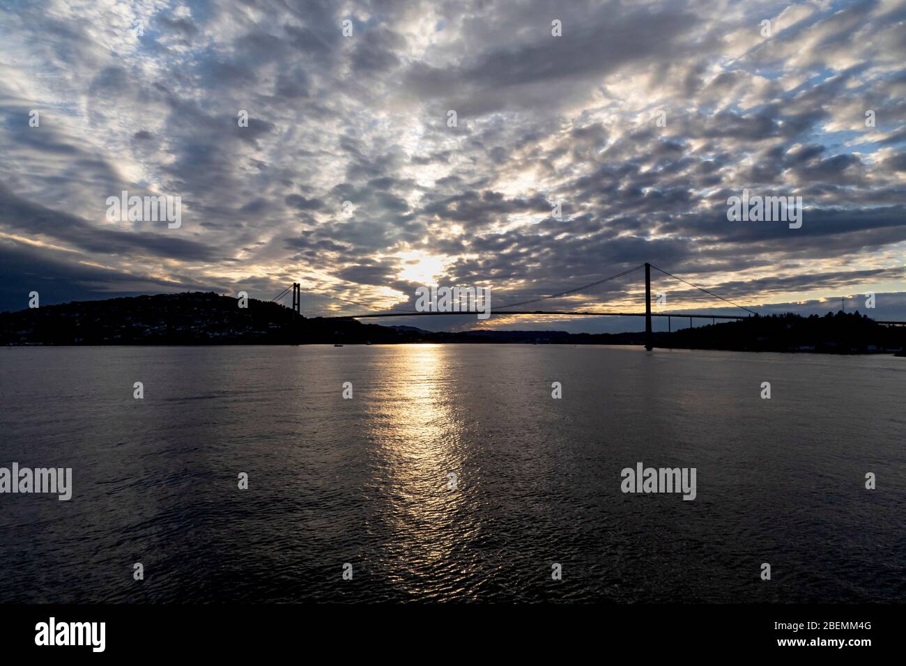 Sunset at Askoey (Askøy) suspension bridge outside port of Bergen, Norway. Stock Photo