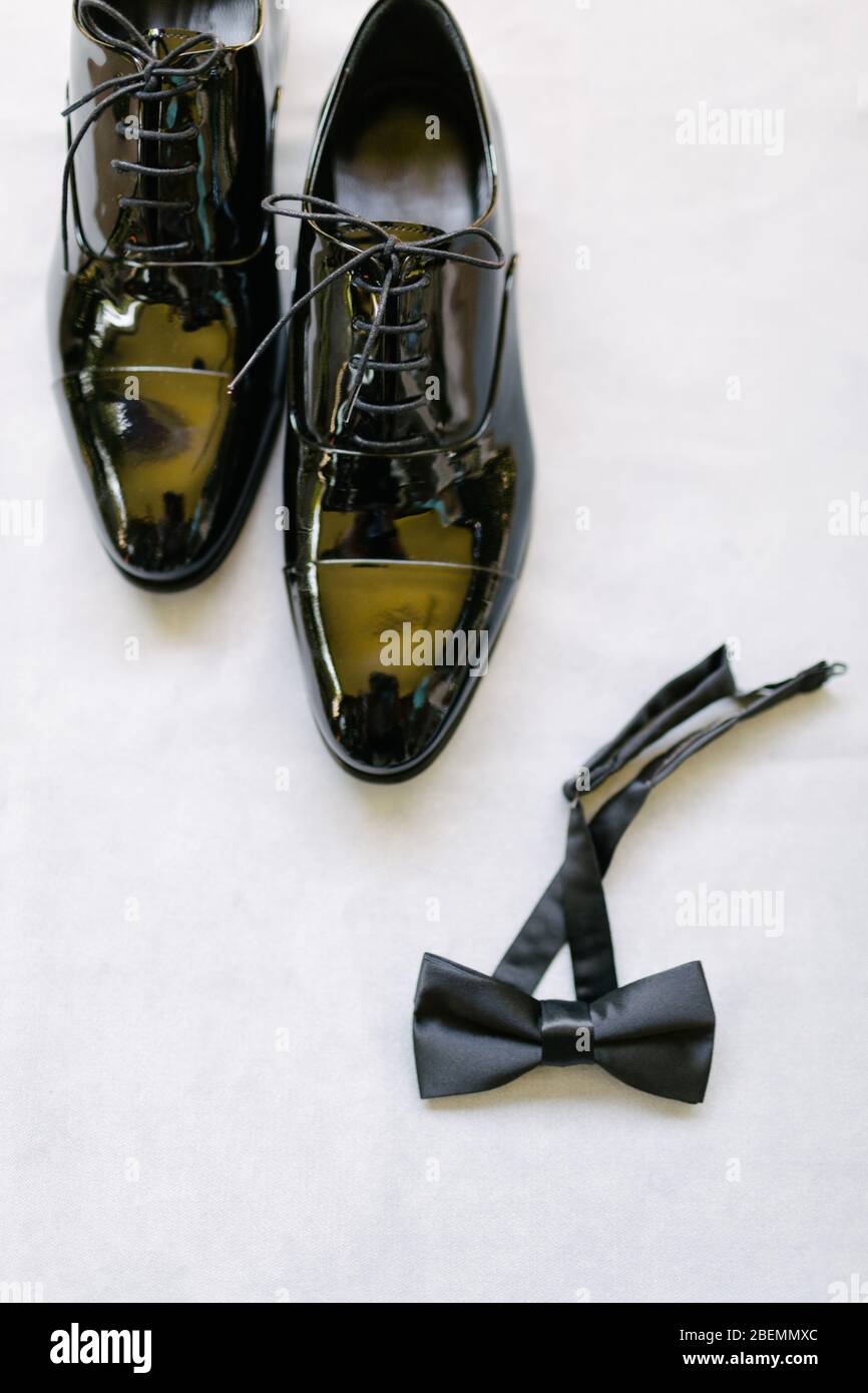Groom shoes and bow tie. Preparations for the wedding day. Stock Photo