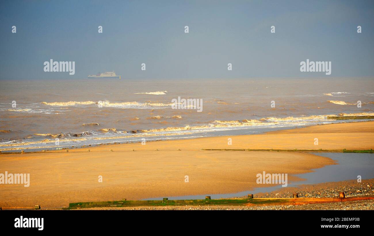 Isle of Mann steam packet ferry on the horizon passing Rossall beach in stormy conditions Stock Photo