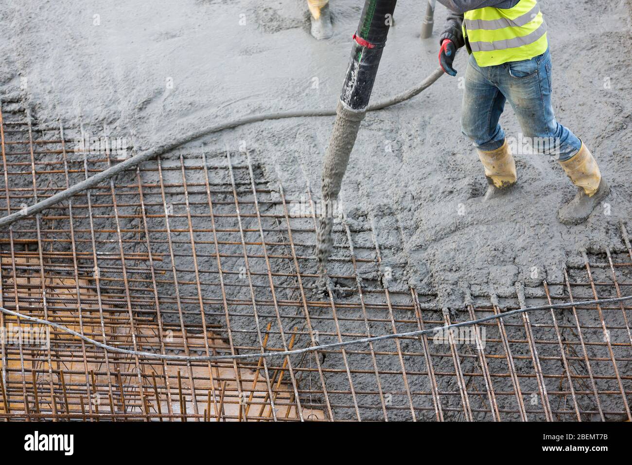distribution of fresh concrete in reinforcement Stock Photo