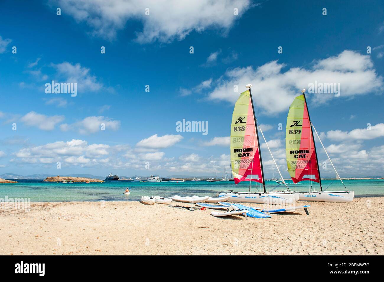 Ses Illetes beach, Formentera, Balearic Islands. Two colorful sailing boats ready to sail into the beautiful sea with intense colors of Mediterranean Stock Photo